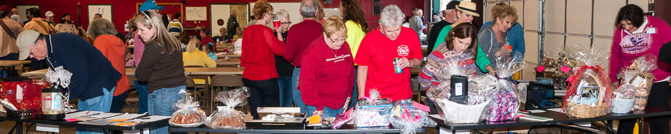 The silent auction at the 2013 Warm Hearts Humane Society Fish Fry and Fundraiser drew lots of attention.